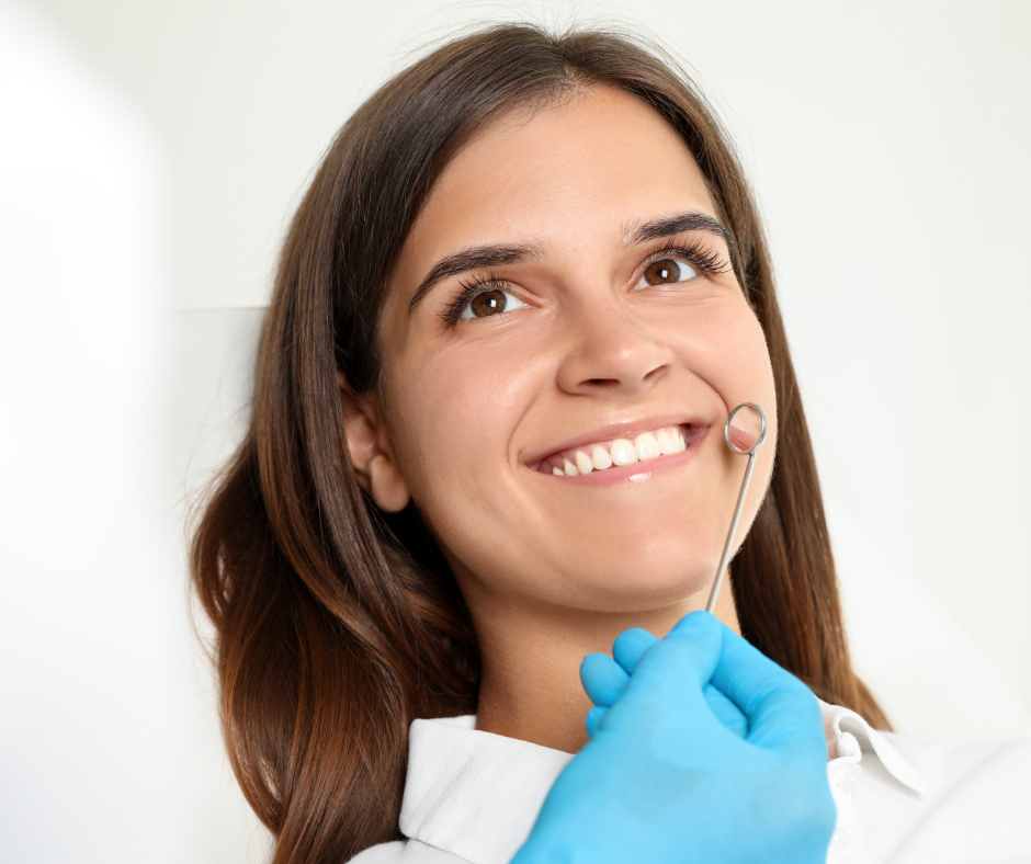 Close up of female patient smiling at the dentist.