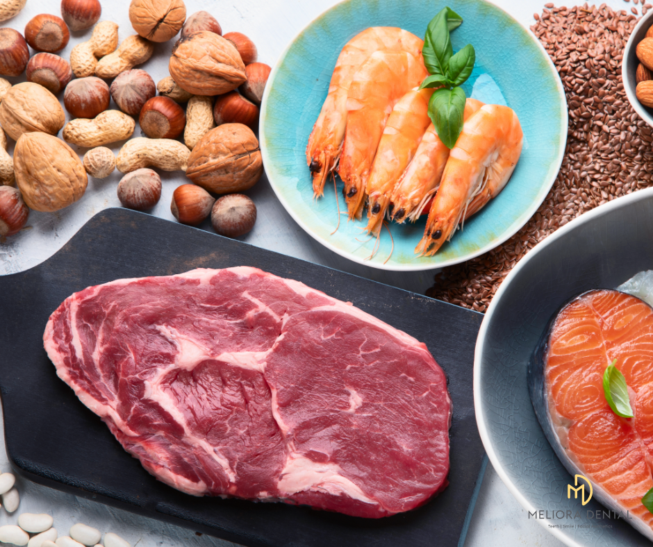 A close up of steak, prawns and nuts rich in phosphorous 